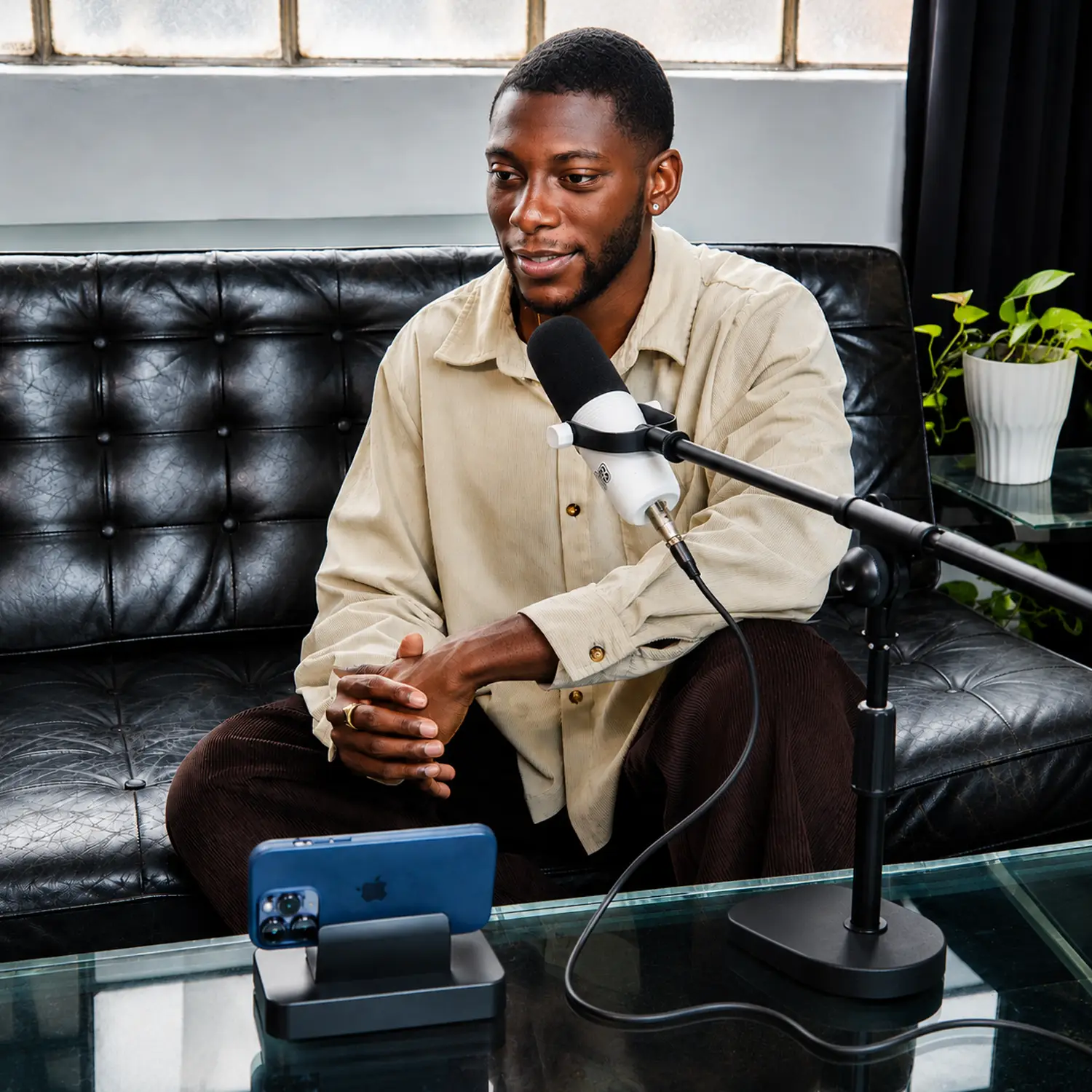 Host speaking into the Podcast in a Box mic