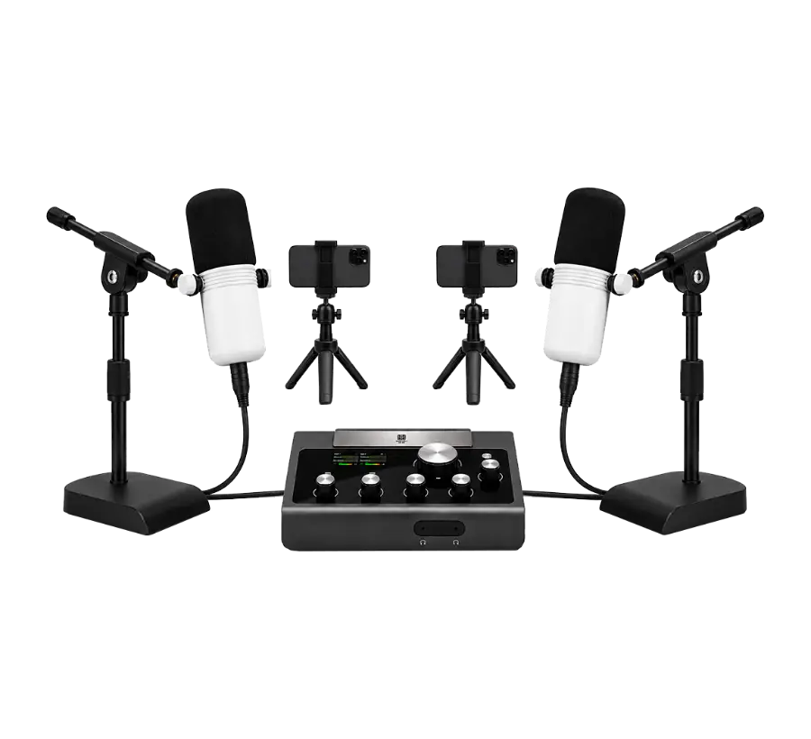 Full podcast kit connected to the audio interface — two mics on stands, two phone tripods and the interface